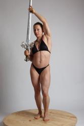 EVA STANDING HOLDING SWORD